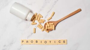 Bottle of probiotic supplements with capsules on a table – supporting gut health and digestion