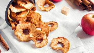 Warm baked apples sprinkled with cinnamon, a naturally sweet dessert that supports healthy digestion.