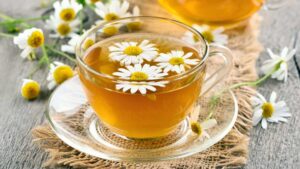 Chamomile tea in a cup, a calming herbal tea that soothes the stomach, aids digestion, and promotes relaxation naturally.