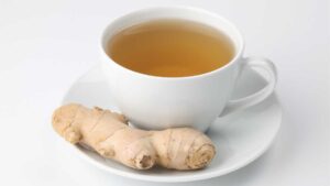 Ginger tea in a cup, a warming herbal tea that soothes the stomach, eases nausea, and promotes healthy digestion naturally.