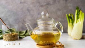 Fennel tea in a kettle, a natural herbal tea that relieves gas, reduces bloating, and supports healthy digestion.