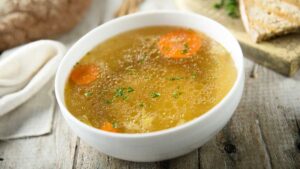 Warm bone broth vegetable soup for gut healing and digestion.