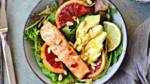 Fresh salmon salad with avocado dressing – omega-3 gut health meal.