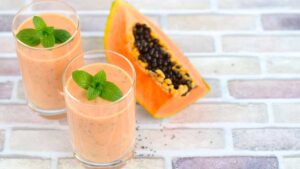 Refreshing papaya smoothie blended with digestive enzymes and gut-friendly ingredients for better digestion.
