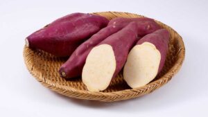 Sweet potatoes on a wooden plate for healthy gut