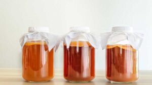 Bottles of kombucha tea with probiotics and antioxidants for gut health and natural digestion support.