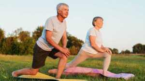 Senior couple exercising outdoors to support healthy digestion and maintain gut microbiome diversity.