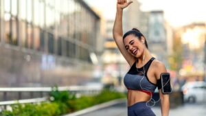 Image of a person feeling happy after a workout, with a brain-gut connection illustration symbolizing reduced stress and better digestion