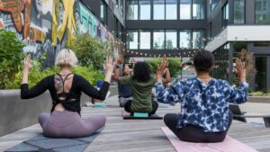 Women doing gentle yoga to support hormone balance and improve gut health.