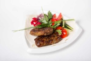 cooked lamb liver, high in iron vitamins and minerals on a plate